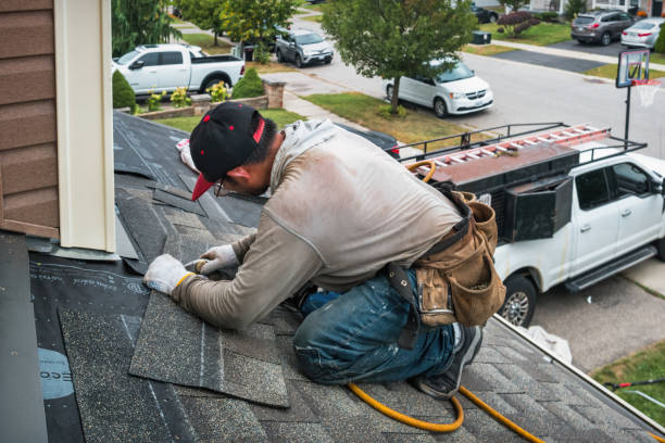Professional Storm Damage Roof Repair technician working in Clarksville, TX